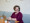 Plus size woman at work in bright, open office workplace with computer